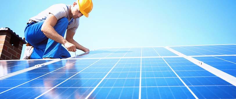 Installer maintaining the solar panels