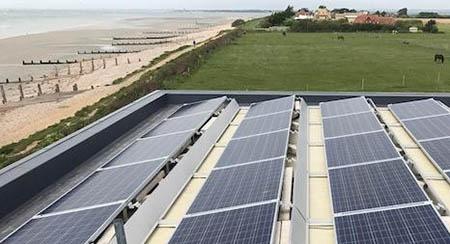 solar panels on flat roof in countryside